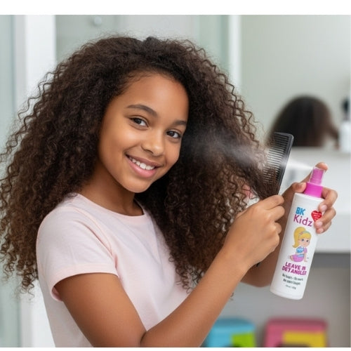 Young girl with curly hair holding a bottle of 'BK Kids' hair product.